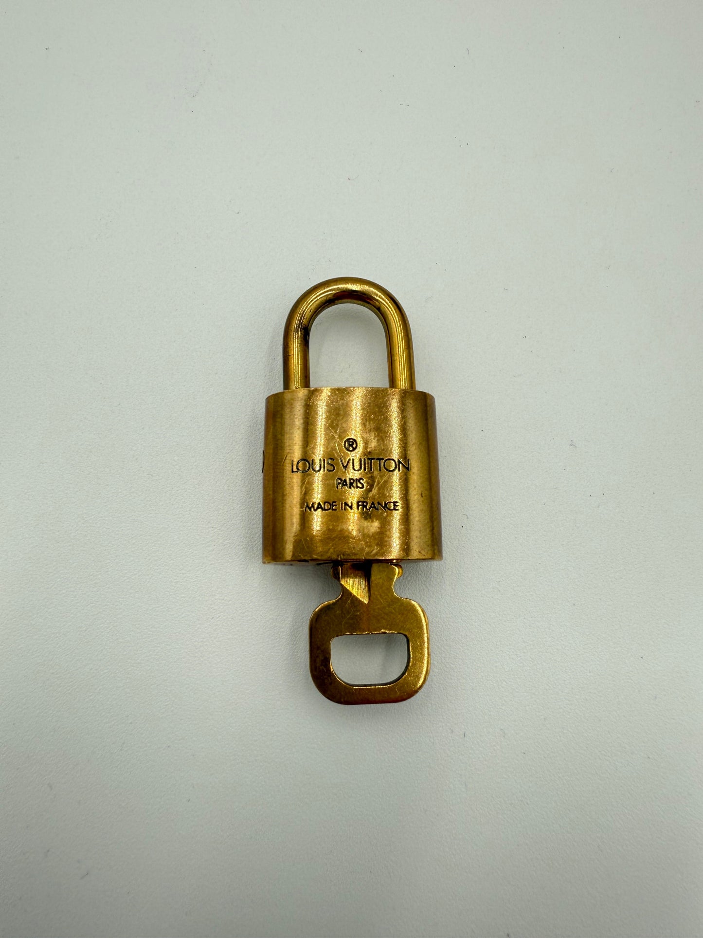 Accessory Luxury Designer Tag By Louis Vuitton In Gold