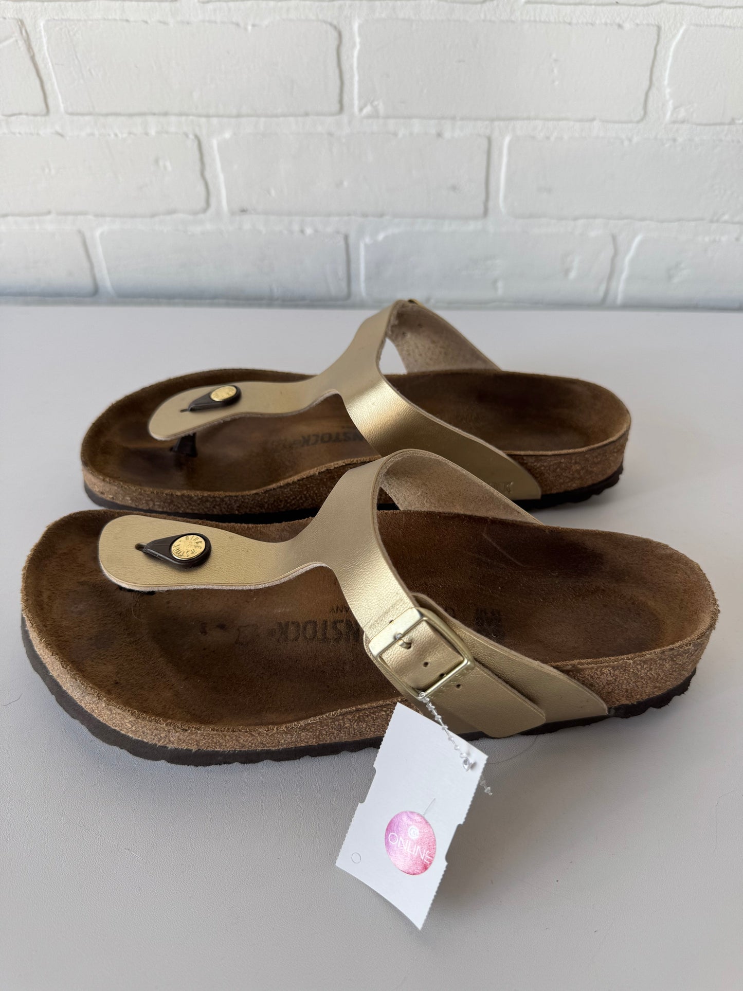 Sandals Flats By Birkenstock In Gold & Tan, Size: 9.5