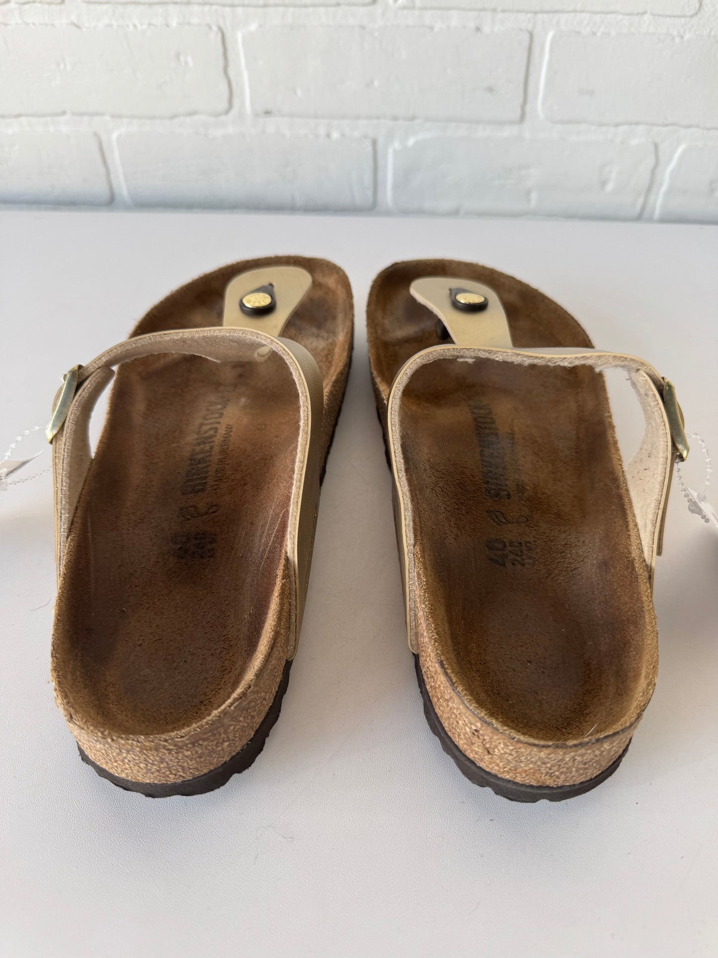 Sandals Flats By Birkenstock In Gold & Tan, Size: 9.5