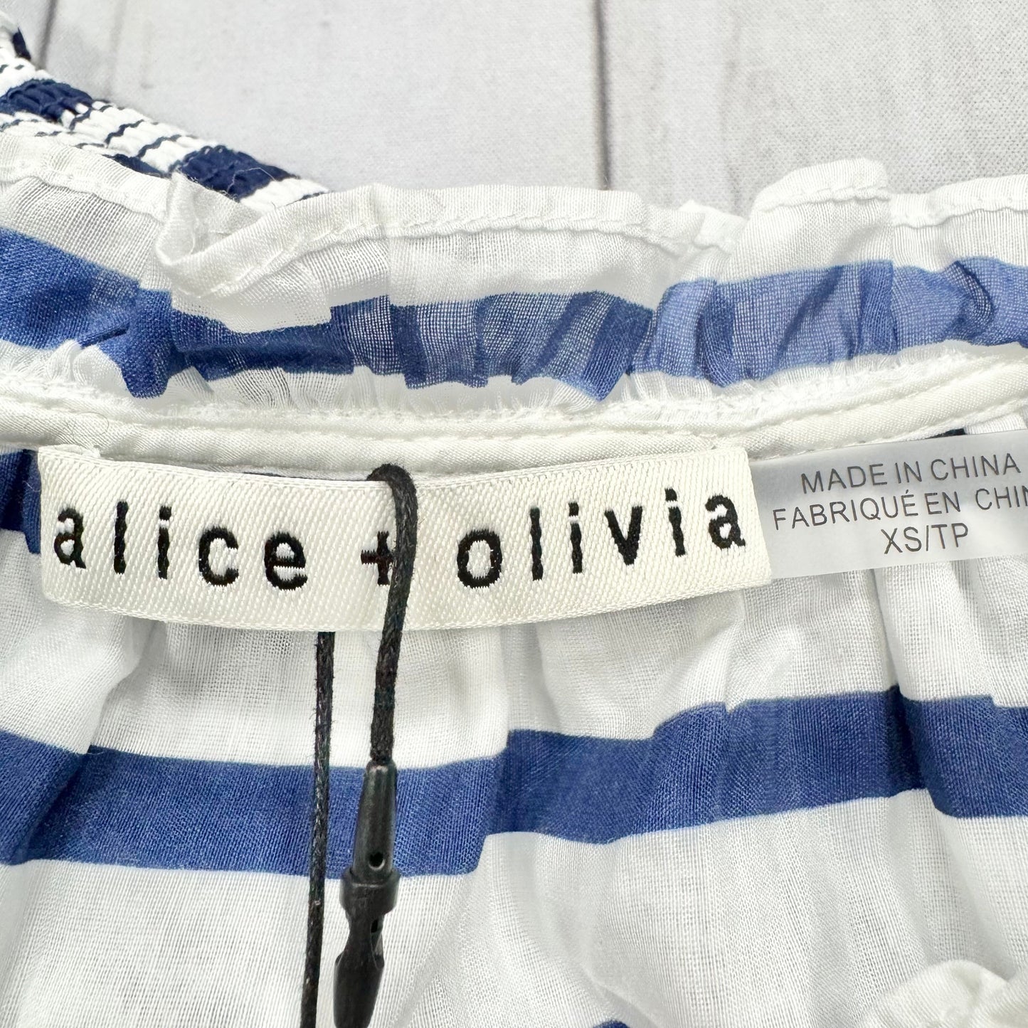 Top Long Sleeve Designer By Alice + Olivia In Blue & White, Size: Xs