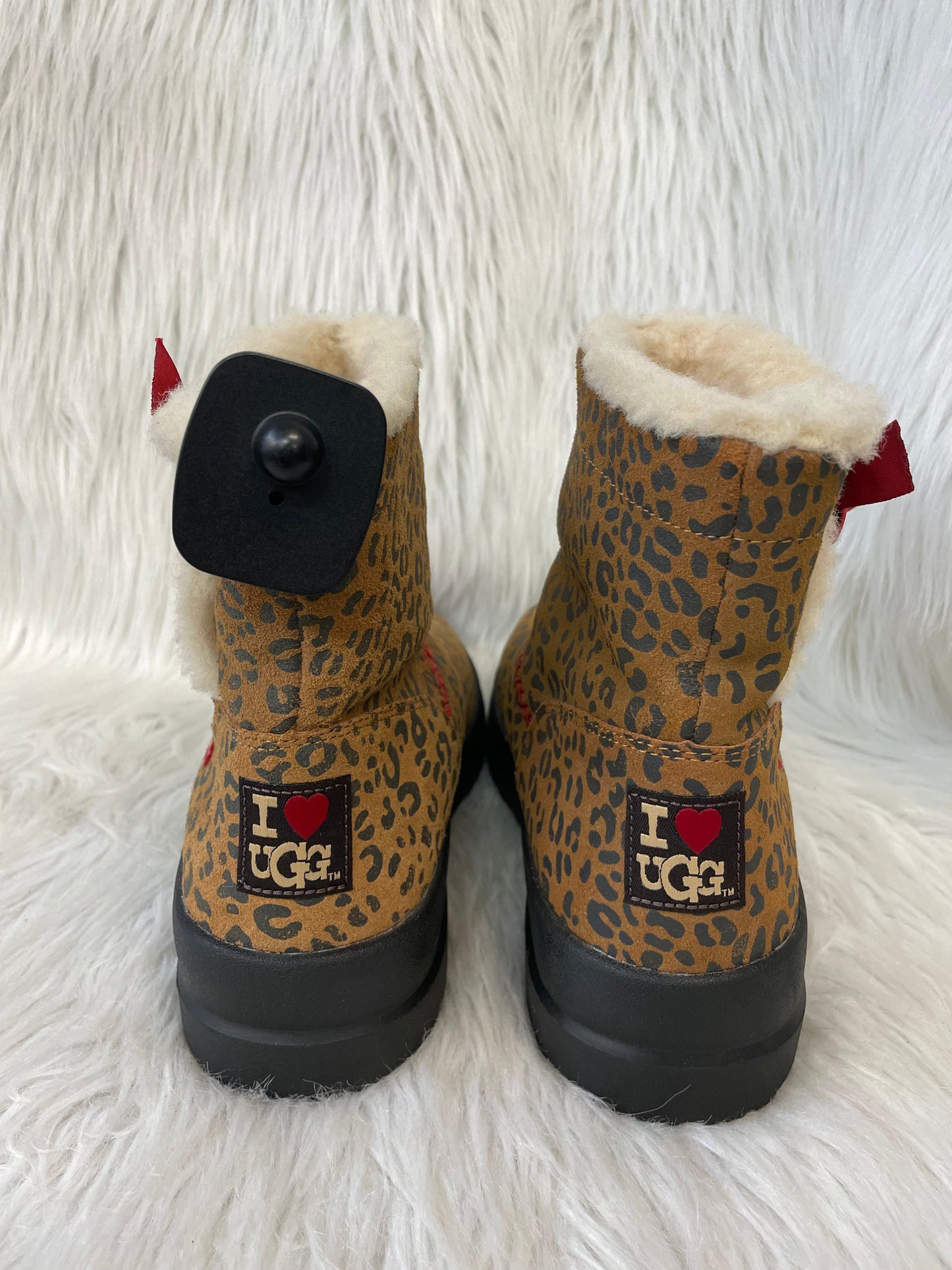 Boots Designer By Ugg In Animal Print, Size: 7